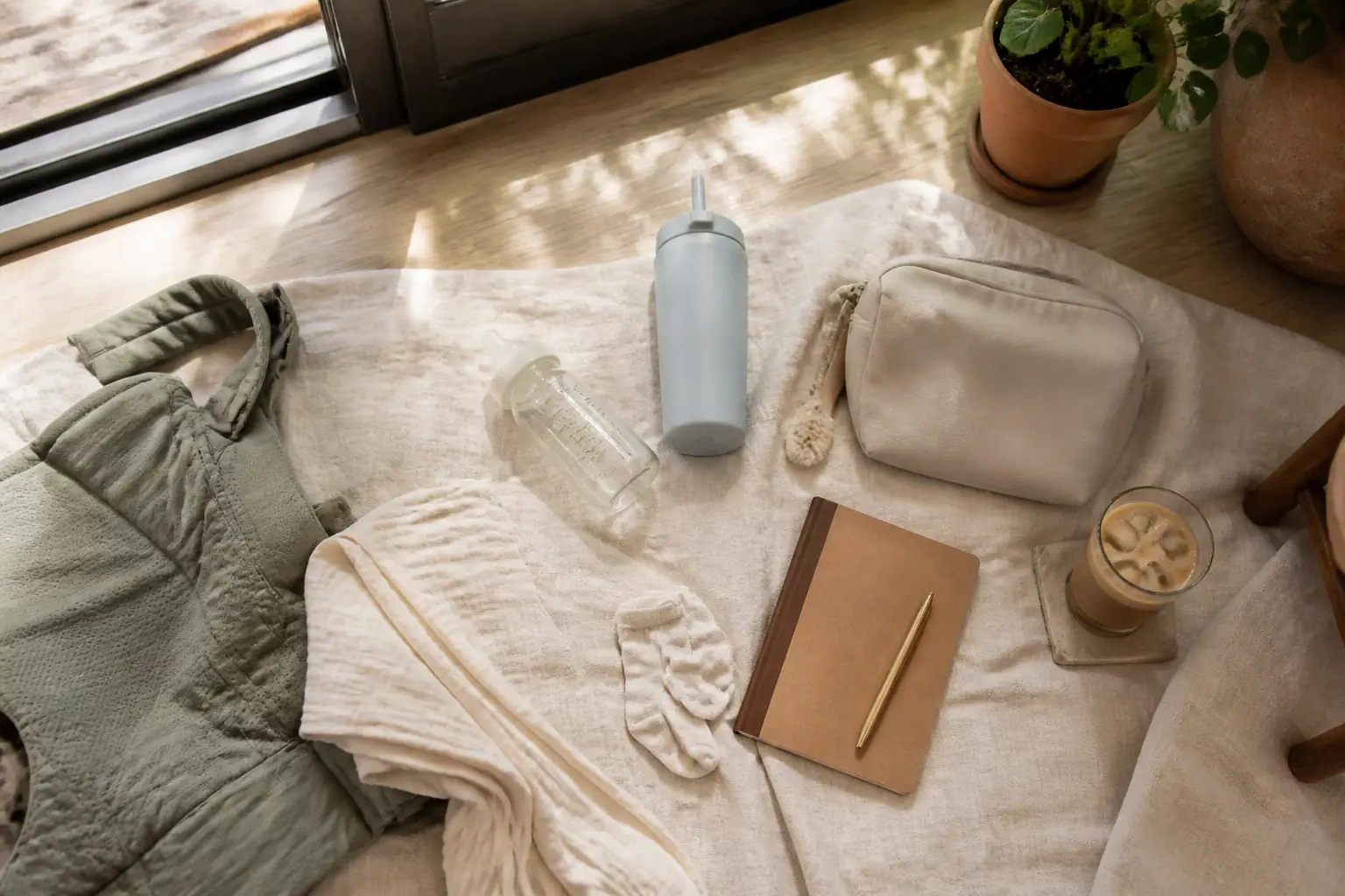 An unbranded flat lay of practical baby and postpartum essentials
